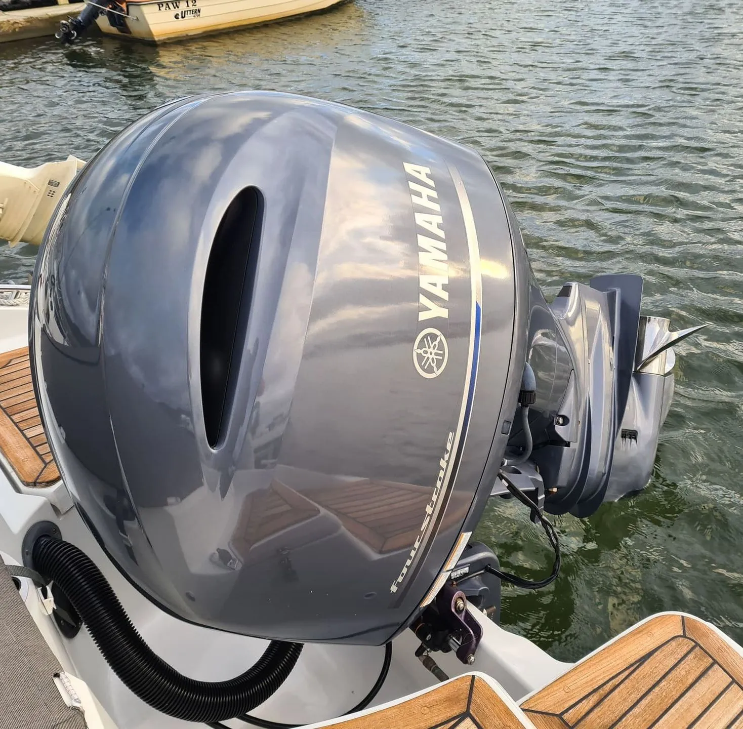 Yamaha outboard engine mounted on boat transom dockside in Jacksonville waters.