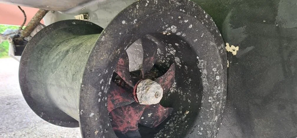Corroded boat propeller with marine growth and oxidation damage requiring replacement.