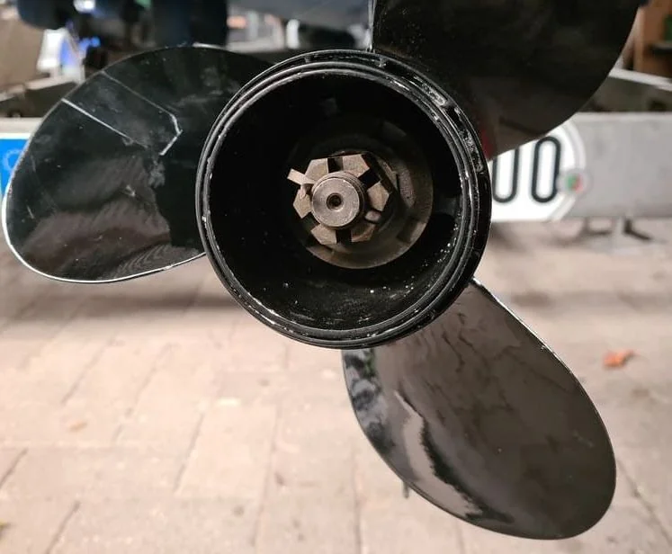 Boat propeller hub removed showing internal gear mechanism and wear patterns.